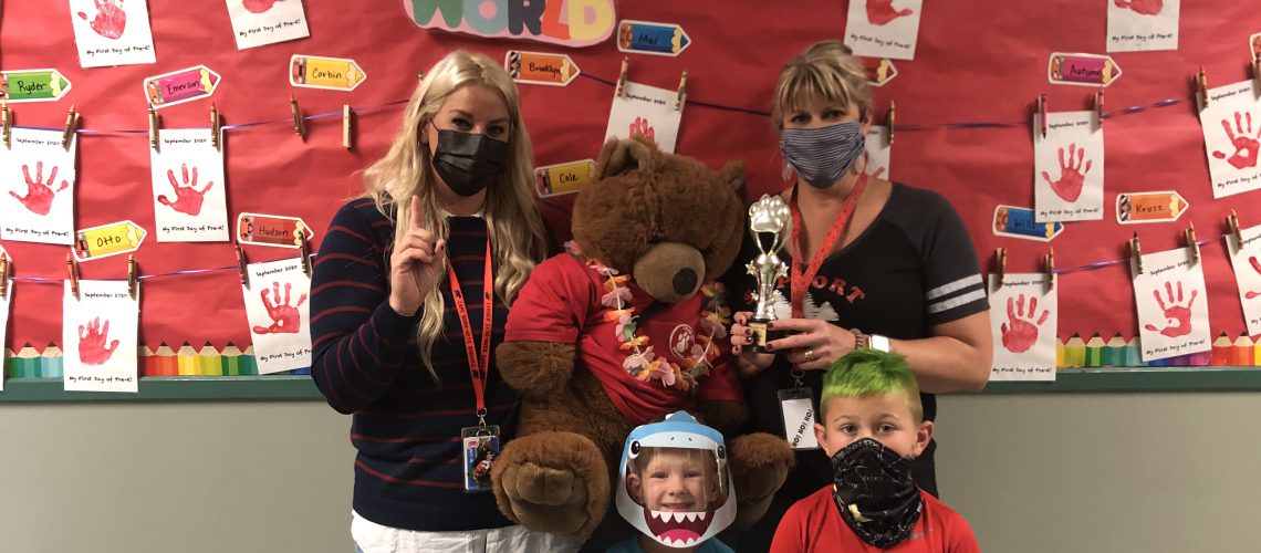 Teacher Megan, Eamon, Teacher Angela, and Jameson accept the CHS Kodiak Spirit Award For October! This is a first for the Pre-K and we are so happy to celebrate with them.