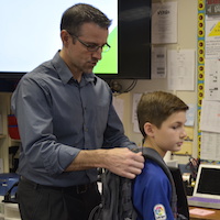 Gause student receives posture assessment from local chiropractor