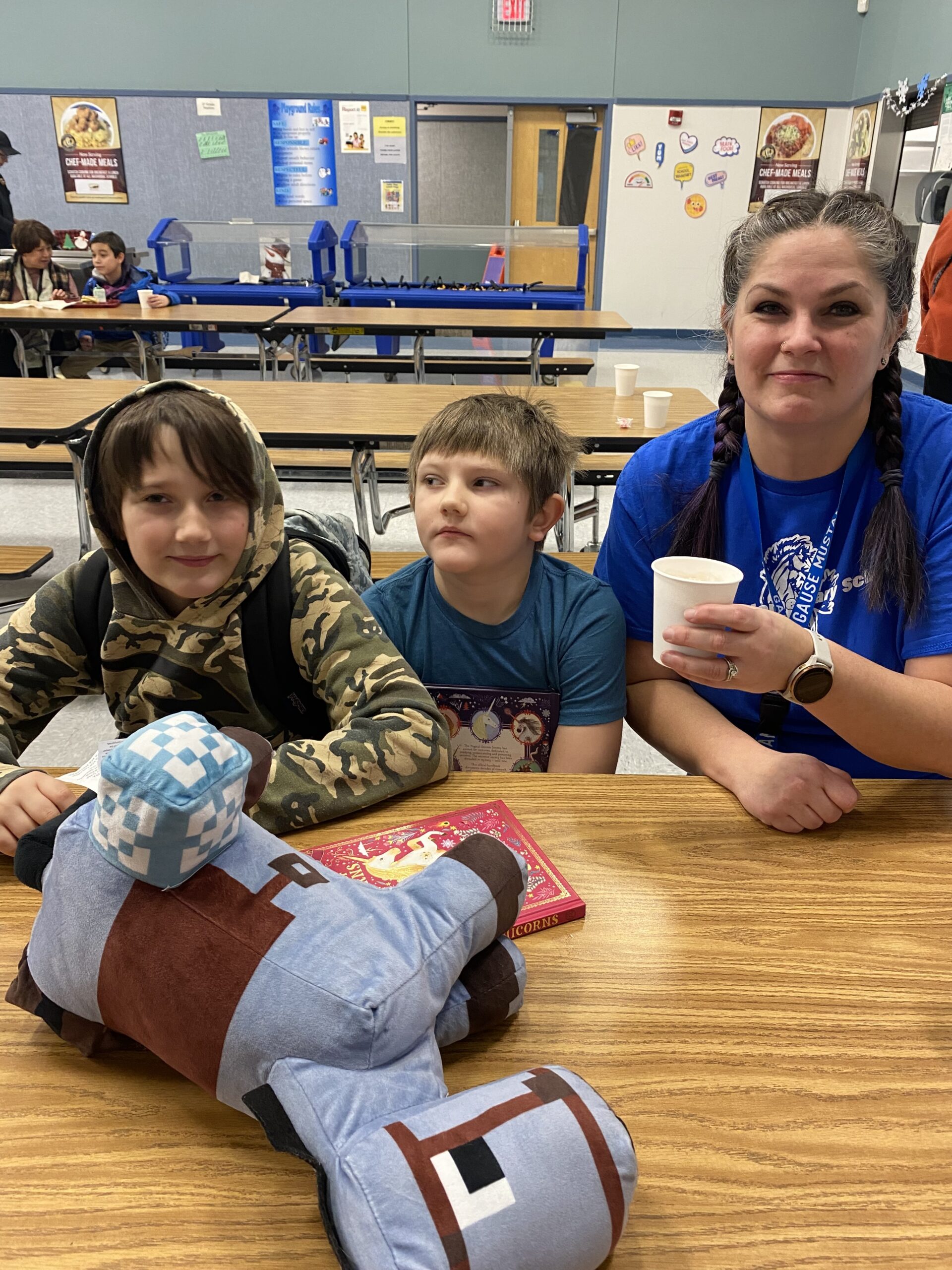 Student and parent enjoy cocoa together in the Gause cafeteria