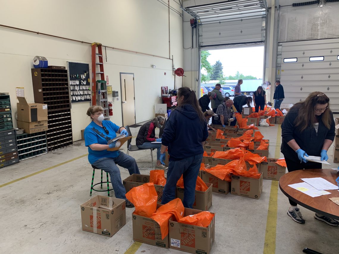 WSD Transportation workers sort food boxes