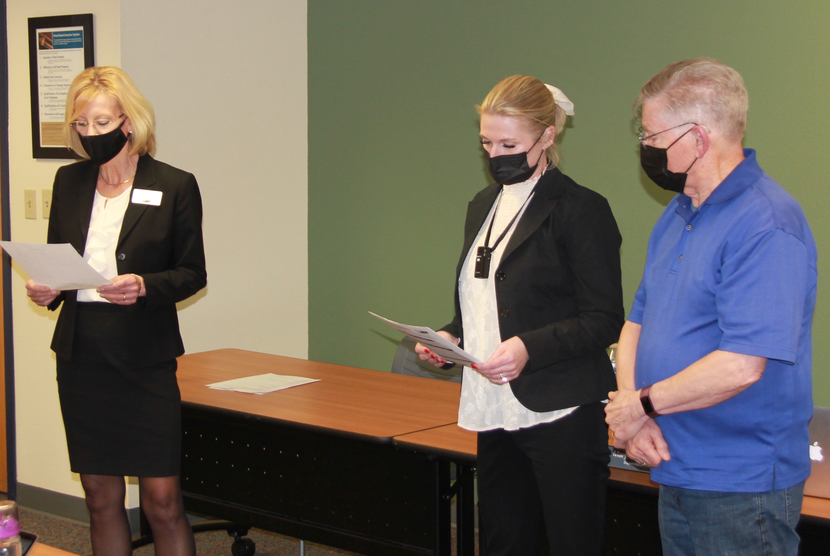 mary templeton administers the oath of office to chuck carpenter, sadie mckenzie  at the 12-14-2021 board meeting