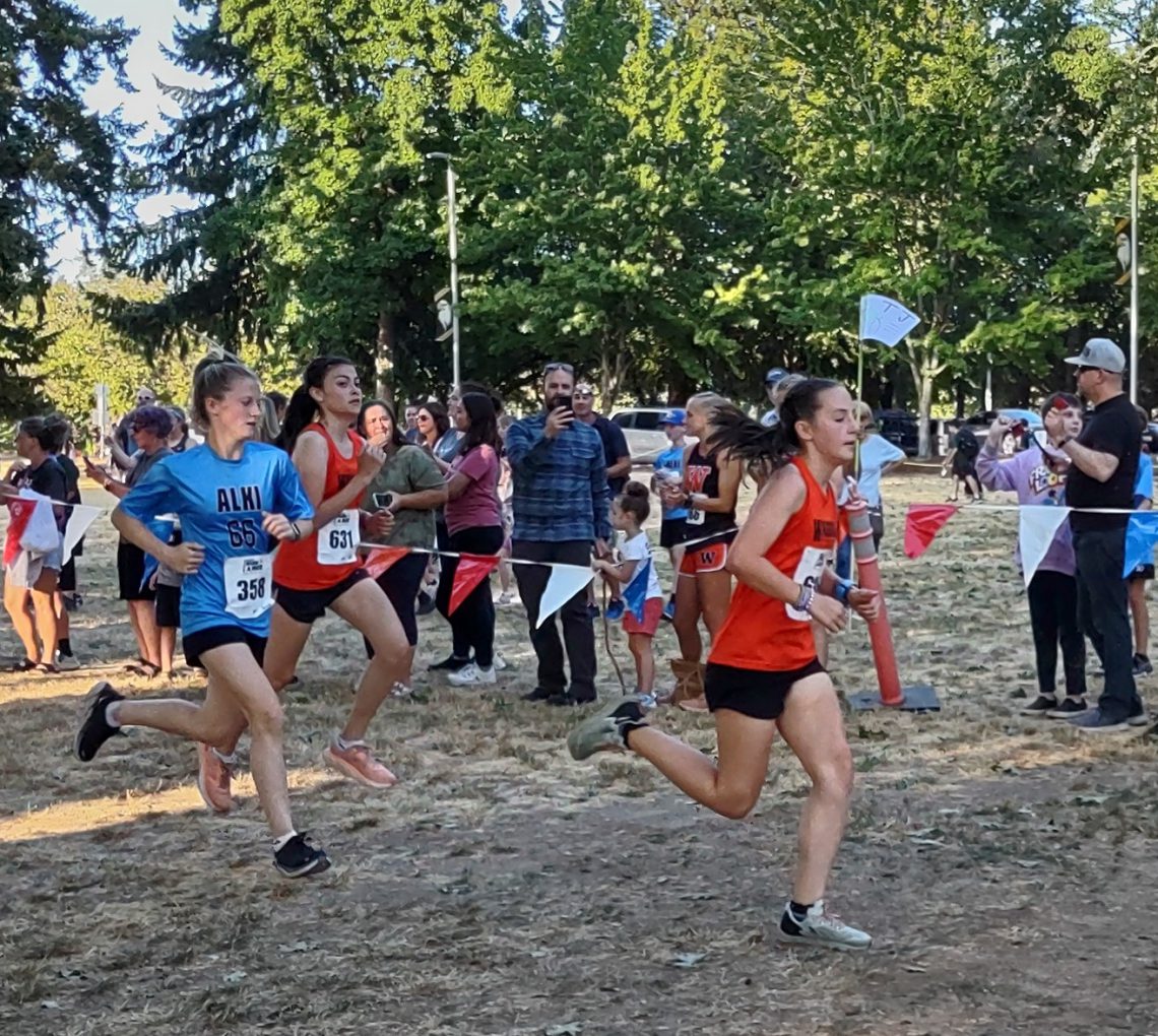 Washougal middle school runners in front of trees on path