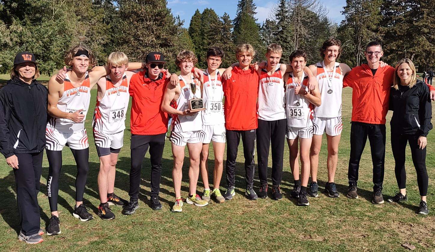 WHS Boys Cross Country runners pose with coaches and trophee