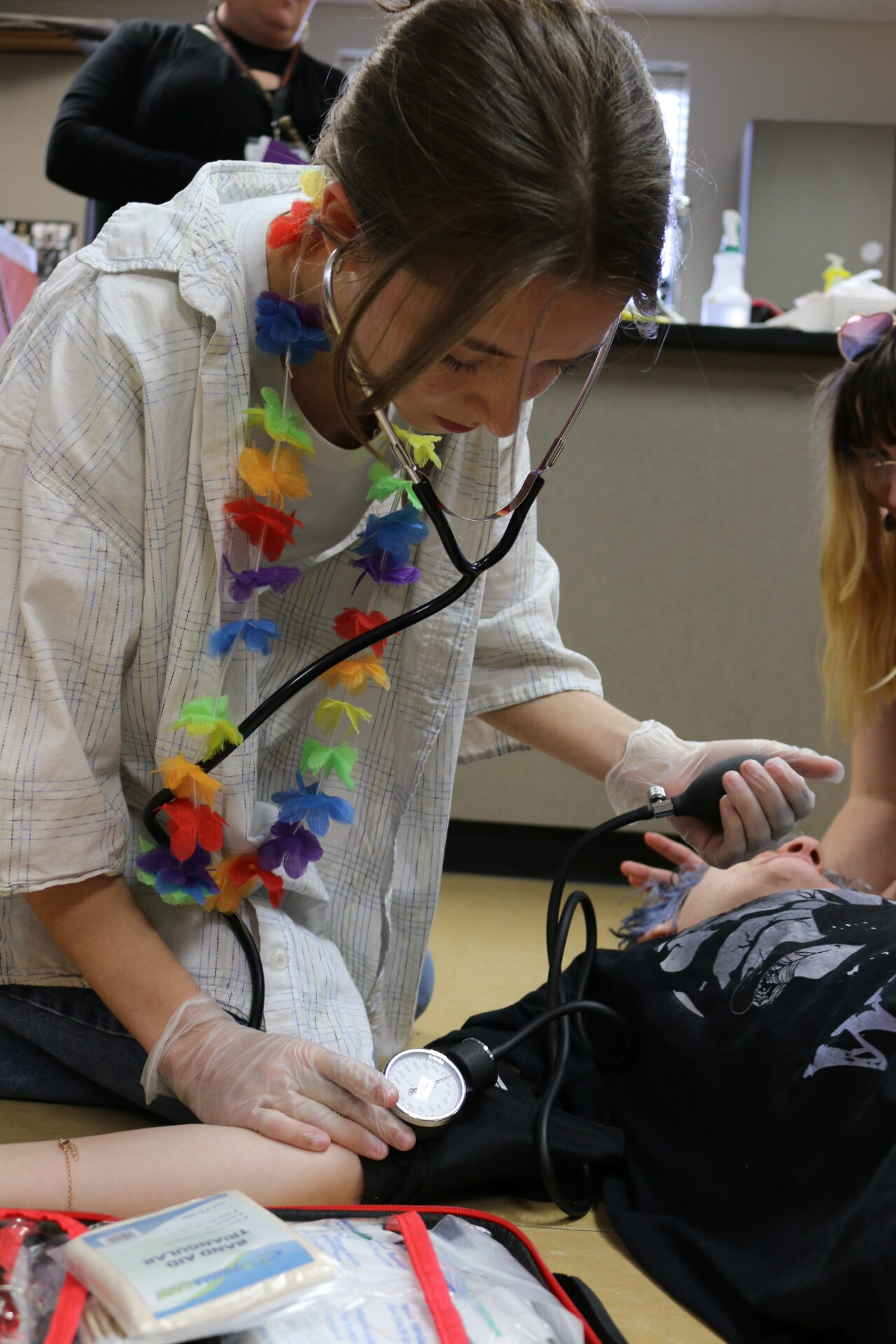 Student practices using a stethoscope and Automated External Defibrillator (AED) in Sports Medicine class at Washougal High School. This was one stop on the AASA site tour at Washougal High School.