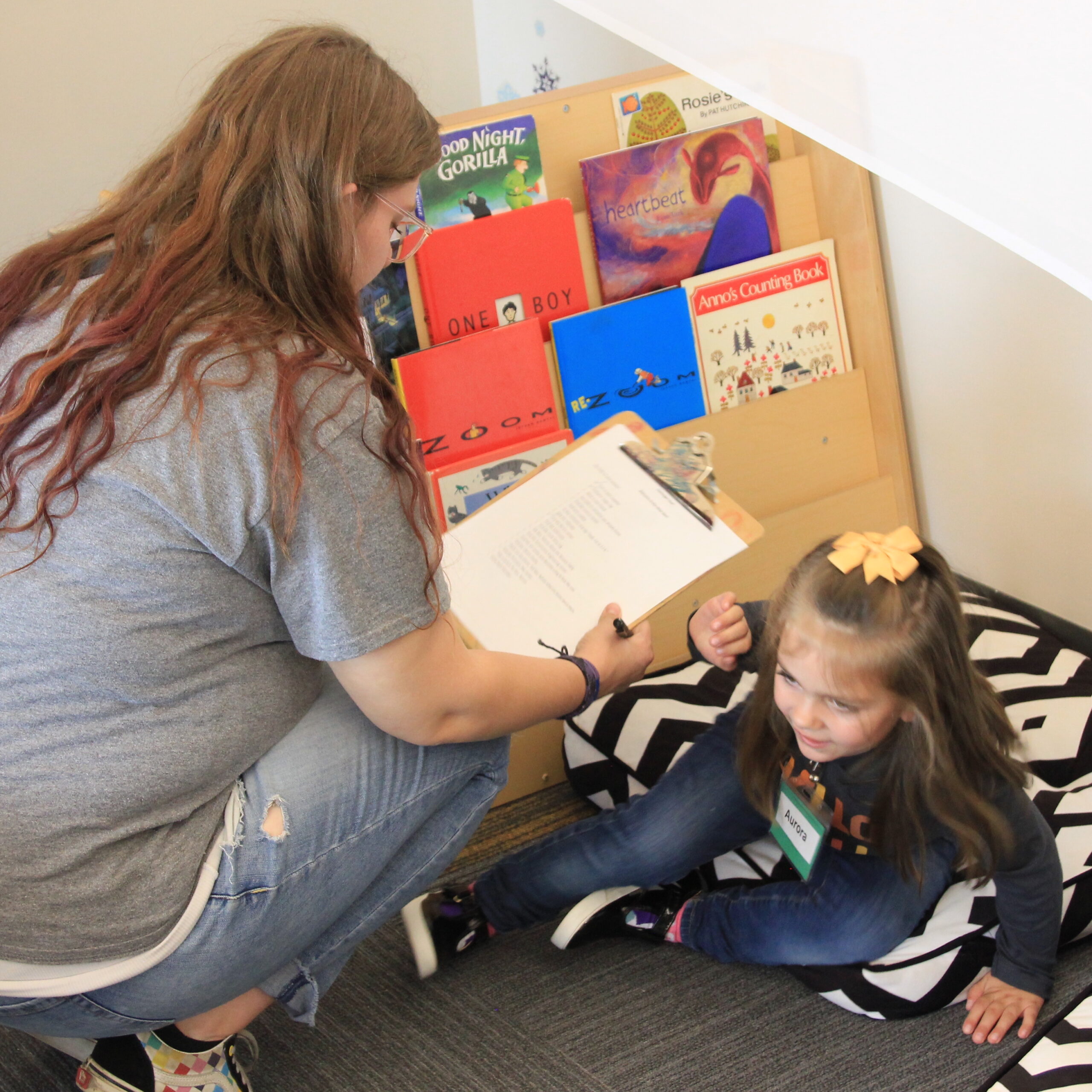 Student explores reading materials in the TK classroom