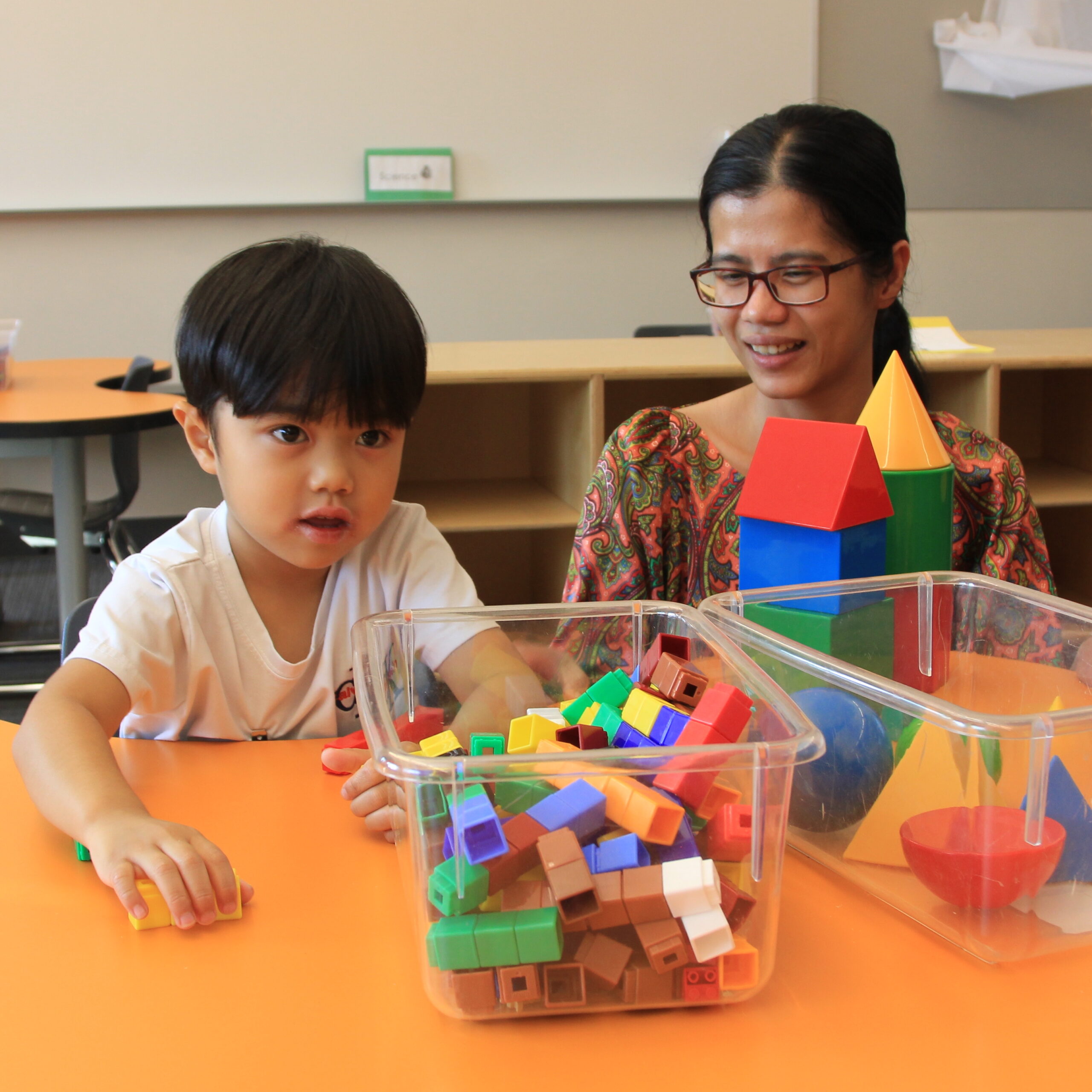 Student explores classroom toys used in  the TK classroom