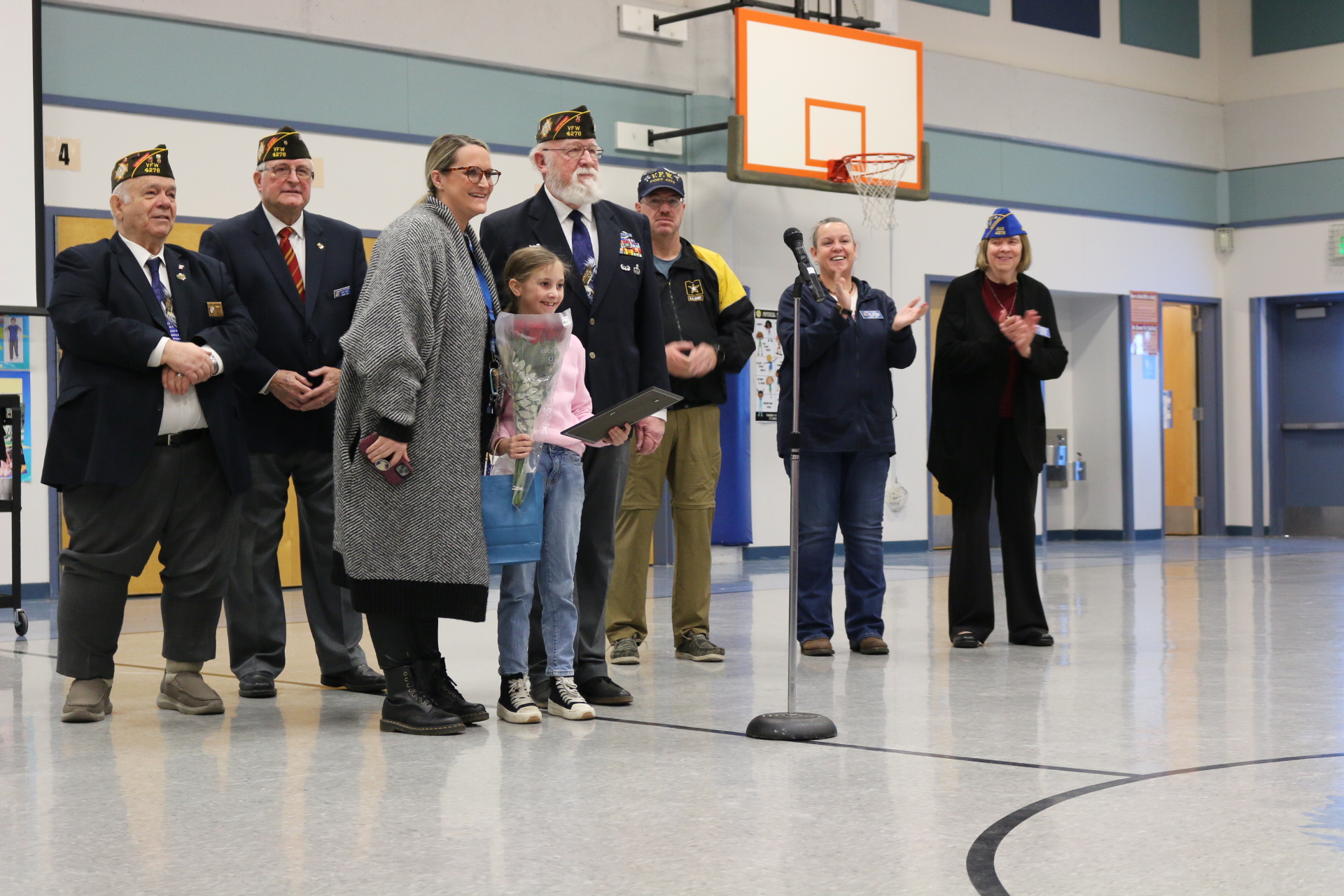 Gause student honored by uniformed Veterans of Foreign Wars with flowers and a certificate