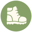 Hiking boot icon inside a green circle